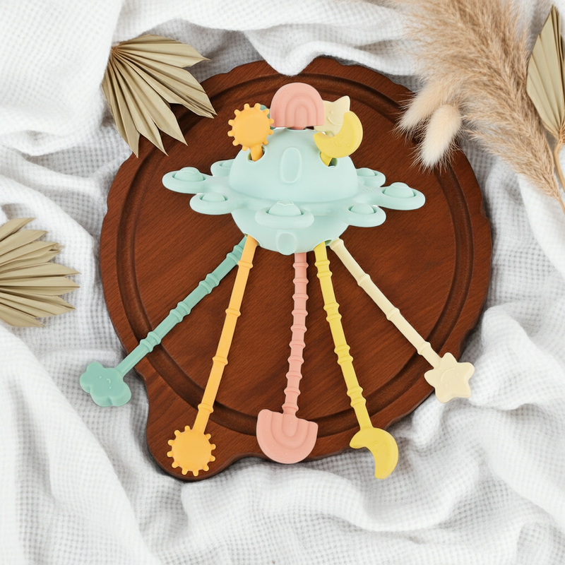 Jouet d'activité Montessori en silicone Planète - Eucalyptus | bieco