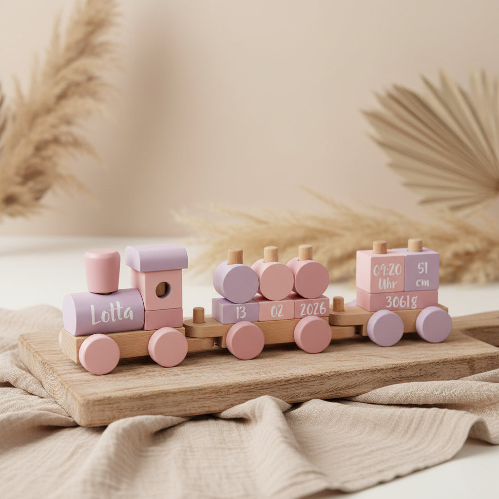 Personalisierter Holzzug in Rosa zur Geburt mit Name und Geburtsdaten als liebevoll gestaltetes Geschenk von Schmatzepuffer