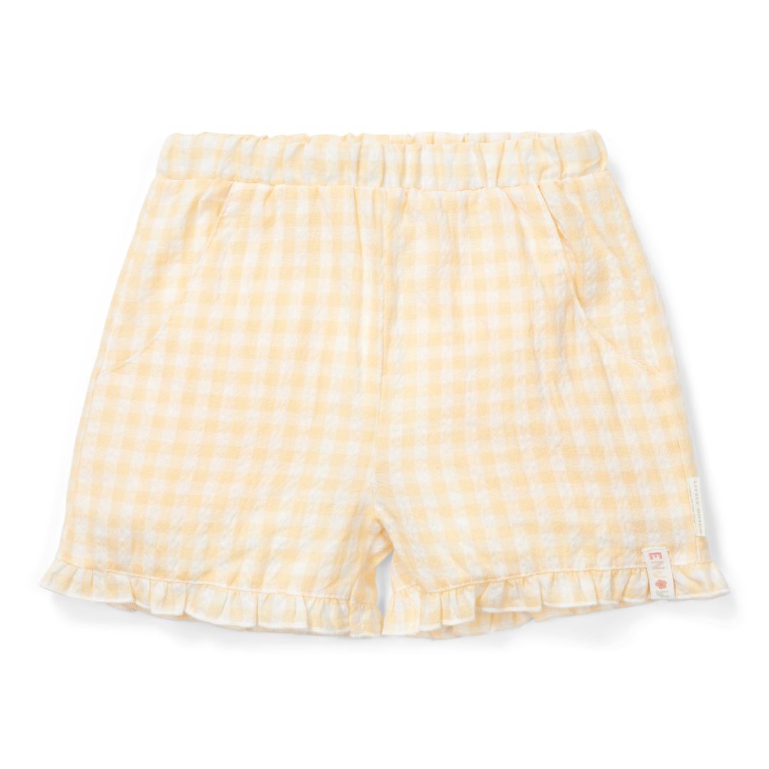 Gelbe Baby-Shorts mit feinem Karomuster und Rüschenabschluss aus weicher Baumwolle – leichte Sommerhose für Babys und Kleinkinder.